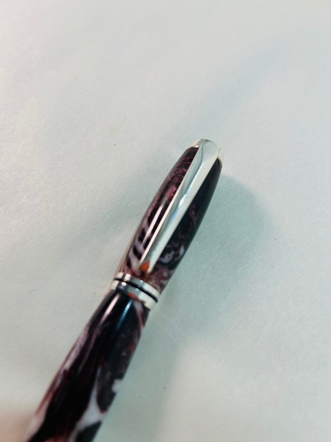 Pen. Fountain pen with silver medal hardware.