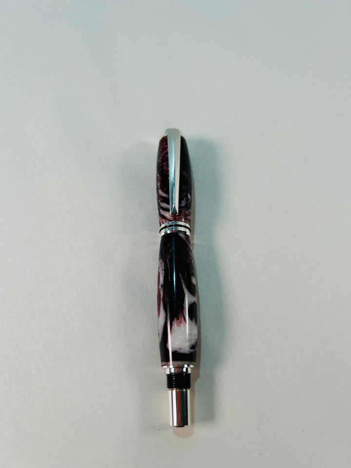 Pen. Fountain pen with silver medal hardware.